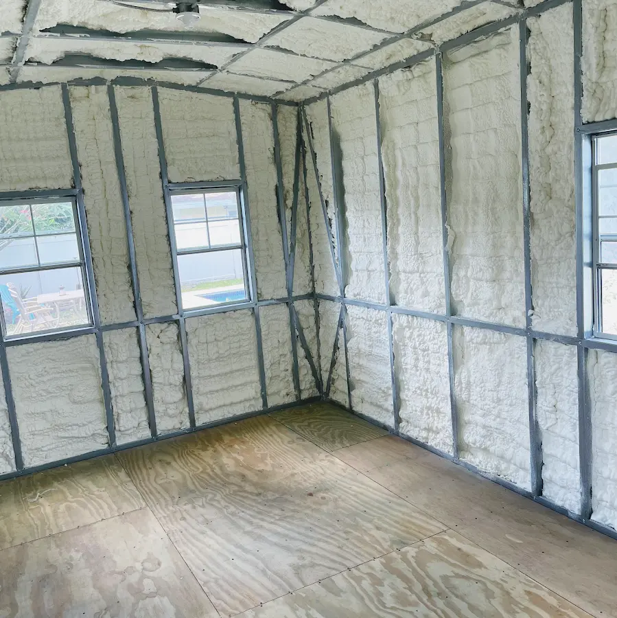 Closed-cell spray foam insulation applied to wall cavities in a residential project in Bixby